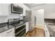 Updated kitchen featuring stainless steel appliances, white cabinets, and granite countertops at 300 W 5Th W St # 407, Charlotte, NC 28202