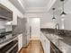 Modern kitchen featuring stainless steel appliances, granite countertops, and dark wood floors at 300 W 5Th W St # 407, Charlotte, NC 28202