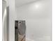Laundry room with stacked washer and dryer at 300 W 5Th W St # 407, Charlotte, NC 28202