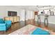 Bright and open living room features hardwood floors, an open-concept kitchen, and stylish decor at 300 W 5Th W St # 407, Charlotte, NC 28202