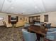 Common area with tables and chairs for relaxation or gathering, and a flatscreen television at 300 W 5Th W St # 407, Charlotte, NC 28202