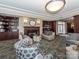 Inviting residents' lounge featuring a fireplace, comfortable seating, and built-in bookshelves at 300 W 5Th W St # 407, Charlotte, NC 28202
