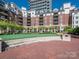 Enjoy a putting green in the well-manicured courtyard featuring surrounding condominium buildings at 300 W 5Th W St # 407, Charlotte, NC 28202