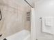 Shower featuring neutral tile, a built-in niche, and a shower head with a shower curtain at 300 W 5Th W St # 407, Charlotte, NC 28202