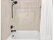 Shower with neutral tile, a built-in niche, and a modern shower head and handle at 300 W 5Th W St # 407, Charlotte, NC 28202