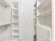 A well-organized walk-in closet with white shelving and drawers, providing excellent storage space at 300 W 5Th W St # 407, Charlotte, NC 28202