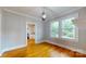 Bright dining room featuring hardwood floors, modern lighting, and an open view to the kitchen at 317 Kings Mountain St, York, SC 29745