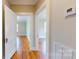 Inviting hallway showcasing gleaming hardwood floors and open doorways to sunlit rooms at 317 Kings Mountain St, York, SC 29745