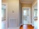 View of the hallway that leads to a bathroom and another room with beautiful hardwood flooring at 317 Kings Mountain St, York, SC 29745