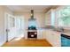 Charming kitchen featuring stainless steel appliances, white cabinets, and wood floors at 317 Kings Mountain St, York, SC 29745