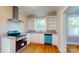 Bright kitchen boasts stainless steel appliances, open shelving and white cabinets at 317 Kings Mountain St, York, SC 29745