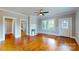 Bright and airy living room with hardwood floors, fireplace, and lots of natural light at 317 Kings Mountain St, York, SC 29745