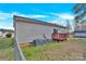 Backyard featuring a wood deck, grassy area, and the exterior of the house, showcasing outdoor space at 340 Vernon Ln, Statesville, NC 28677