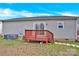 Backyard with wooden deck, grass, and exterior view, highlighting outdoor potential at 340 Vernon Ln, Statesville, NC 28677