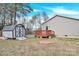 Backyard featuring a shed and deck, offering space for outdoor activities and storage at 340 Vernon Ln, Statesville, NC 28677