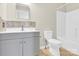 Bathroom featuring modern vanity with decorative backsplash, toilet, and shower-tub combination at 340 Vernon Ln, Statesville, NC 28677
