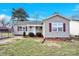 Charming single-story home with vinyl siding, red shutters, and a well-maintained front yard at 340 Vernon Ln, Statesville, NC 28677
