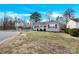 Charming single-story home featuring a carport and a well-maintained front yard with budding plants at 340 Vernon Ln, Statesville, NC 28677