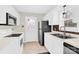 Bright kitchen featuring white cabinets and modern appliances, designed for efficient meal preparation at 340 Vernon Ln, Statesville, NC 28677