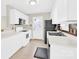 Functional kitchen featuring white cabinets, a black refrigerator, and essential appliances for meal preparation at 340 Vernon Ln, Statesville, NC 28677