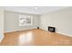 Cozy living room featuring laminate flooring, neutral paint, and a large window for ample natural light at 340 Vernon Ln, Statesville, NC 28677