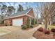 Charming brick home featuring an attached garage and well-manicured landscaping, adding to its curb appeal at 3615 Wild Rose Ct, Matthews, NC 28104