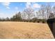 Expansive backyard featuring a well-maintained lawn enclosed by a secure fence, perfect for outdoor activities at 4034 Sagemont Nw Dr, Concord, NC 28027