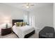 Inviting bedroom with a decorative lamp on a bedside table at 4034 Sagemont Nw Dr, Concord, NC 28027