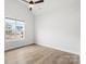Bedroom features beautiful hardwood floors and natural light from a large window at 4034 Sagemont Nw Dr, Concord, NC 28027
