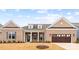 Charming brick home featuring an attached garage and a well-manicured lawn at 4034 Sagemont Nw Dr, Concord, NC 28027
