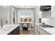 Bright kitchen features stainless steel appliances, center island and an adjacent dining area at 4034 Sagemont Nw Dr, Concord, NC 28027