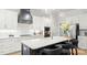 Modern kitchen featuring a large island with seating, stainless steel appliances, and ample cabinets at 4034 Sagemont Nw Dr, Concord, NC 28027