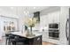 Stylish kitchen boasts a large island with seating, stainless steel appliances, and lots of storage at 4034 Sagemont Nw Dr, Concord, NC 28027