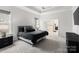 Spacious main bedroom boasts tray ceilings, plush carpet, and an en-suite bathroom at 4034 Sagemont Nw Dr, Concord, NC 28027