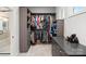 Well-organized walk-in closet with custom shelving, drawers, and ample storage space at 4034 Sagemont Nw Dr, Concord, NC 28027