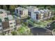 New construction townhomes feature stylish exteriors, rooftop decks, and landscaped surroundings at 5007 Nimes Rd # 28, Charlotte, NC 28208