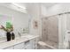 Bright bathroom featuring a modern sink, toilet, and shower with white marble tile at 5007 Nimes Rd # 28, Charlotte, NC 28208