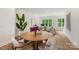 Stylish dining room area featuring a round wooden table, modern decor, and an open floorplan at 5007 Nimes Rd # 28, Charlotte, NC 28208