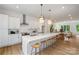 Modern kitchen featuring a large island, stainless steel appliances, and pendant lighting at 5007 Nimes Rd # 28, Charlotte, NC 28208