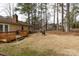 Home featuring a wooden deck and spacious backyard with mature trees at 5060 Post Oak Ln, Rock Hill, SC 29732
