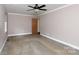 Spacious bedroom with neutral paint, carpeted floors, and a ceiling fan at 5060 Post Oak Ln, Rock Hill, SC 29732