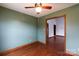 Cozy bedroom with hardwood floors, green walls, and ample natural light at 5060 Post Oak Ln, Rock Hill, SC 29732