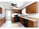 Functional kitchen with wood cabinets, modern appliances, and easy access to the outdoors at 5060 Post Oak Ln, Rock Hill, SC 29732