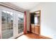 Bright living room shows glass doors to the deck and a convenient wet bar at 5060 Post Oak Ln, Rock Hill, SC 29732