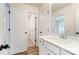 Clean bathroom with hardwood floors, white fixtures, and a view to a closet at 5116 Heathland Dr # 76, Charlotte, NC 28215