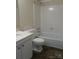 Well-lit bathroom featuring a bathtub, white vanity and tile backsplash at 6354 Old Pineville Rd # A, Charlotte, NC 28217