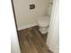 Cozy half bath featuring modern commode and faux wood flooring at 6354 Old Pineville Rd # A, Charlotte, NC 28217