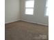 Bright bedroom with carpet, neutral wall color and natural light at 6354 Old Pineville Rd # A, Charlotte, NC 28217