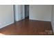 Spacious living room featuring neutral wall color, hardwood flooring and natural light at 6354 Old Pineville Rd # A, Charlotte, NC 28217