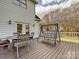 Charming back deck with outdoor seating, perfect for enjoying the serene backyard view at 7811 Biddstone Ct, Charlotte, NC 28226